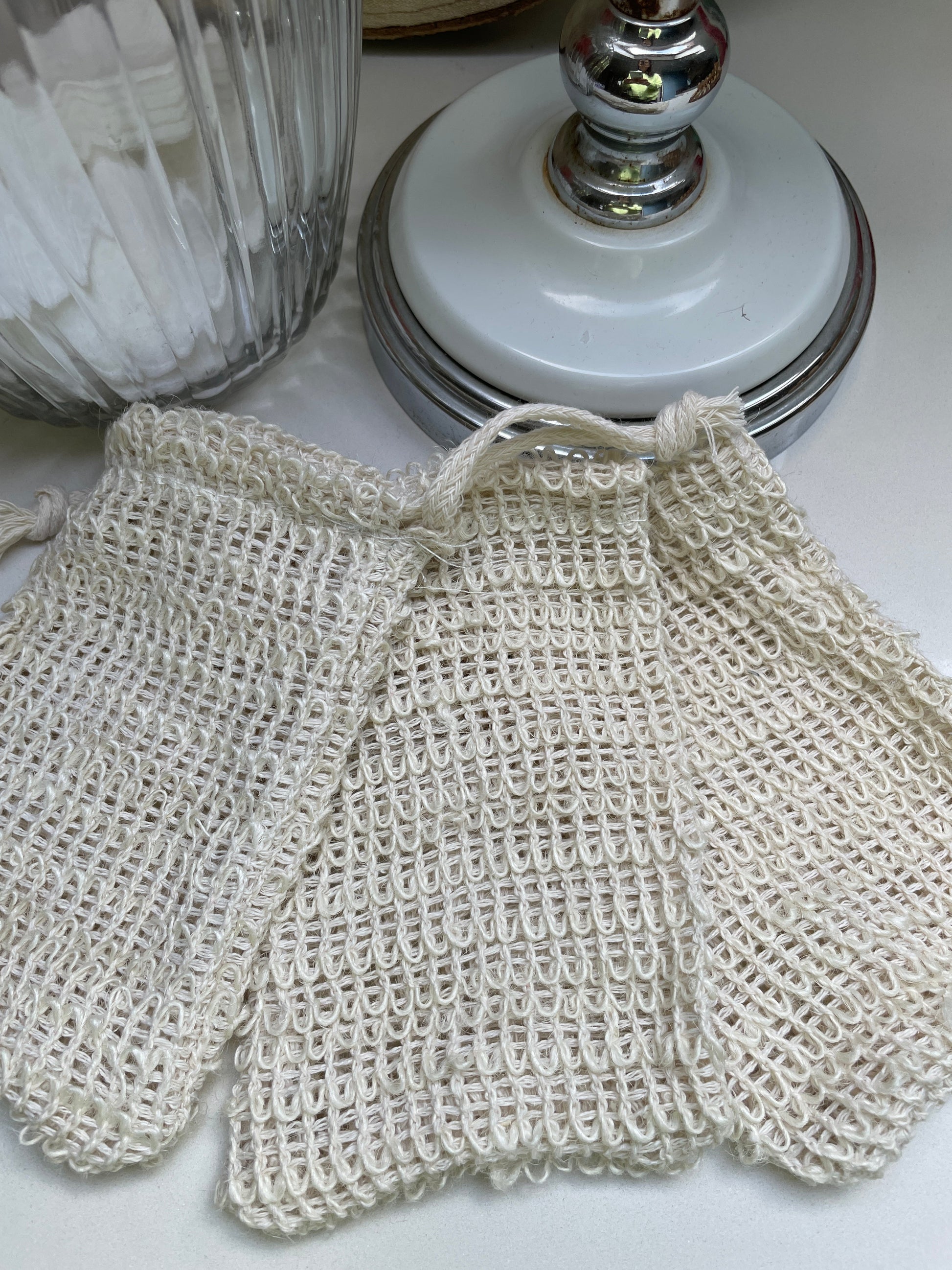 Sisal soap saver is a drawstring bag for holding soap bars, made from natural sisal.